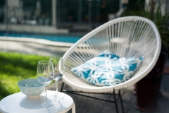Garden with wine glasses and pool