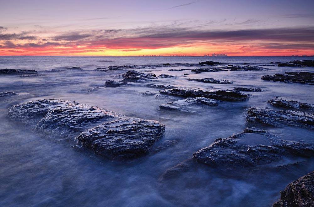 Collaroy Beach reflective rocks morning