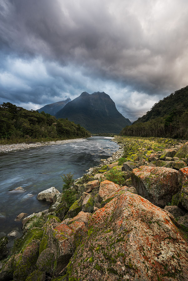 Cloudy mountain landscape with river Milford Sound