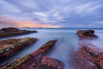 Serene sunset at snapper rocks, embodying tranquil ocean photography for wall art.
