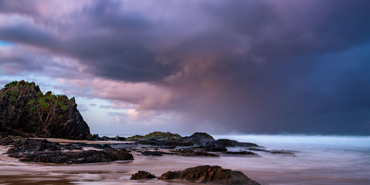 Storm clouds gathering over the silent guardian, Elephant Rock, at Currumbin Beach.