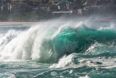 Majestic green wave captured in wave photography, ideal for an ocean print from Bondi Beach.