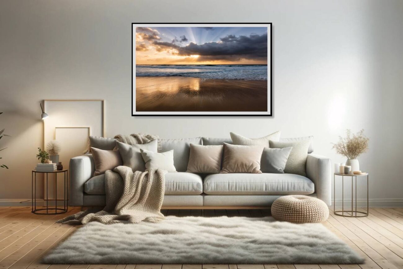 The living room features a framed art piece showcasing early morning sunbeams over the calm waters of Bronte Beach, creating a tranquil sunrise scene. This artwork infuses the space with a sense of peace and the rejuvenating energy of a new day, perfect for enhancing the room's ambiance with natural beauty.