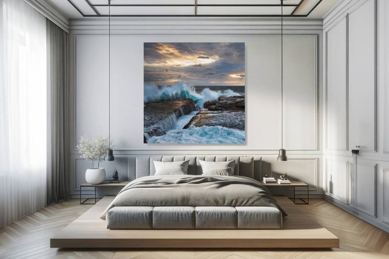 In the bedroom, canvas art features "Gulls in the Glowing Gale," illustrating the two seagulls above Clovelly Beach's turbulent waters under the radiant morning sky. This piece brings a sense of peace and awe, perfect for creating a tranquil and uplifting bedroom environment.