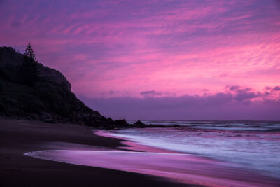 Sunrise at Coalcliff Beach under a purple sky, captured in this striking piece of purple wall art.