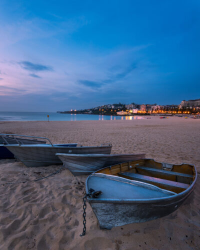 Coogee Beach at dawn with a pastel sky, showcasing a serene marina, ideal for tranquil wall art.