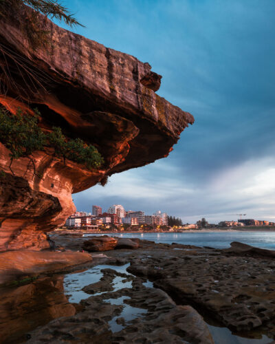 Stunning sunrise over rock formations at Cronulla, resembling a guardian as the day begins.