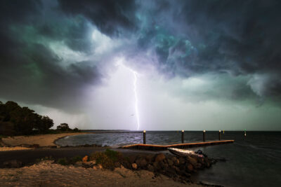 Dramatic lightning strike at sunset on Cronulla's coastline, titled "Call of Thor," a perfect storm artwork piece.