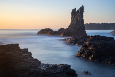 Spires at Dawn – The towering rock formations of Cathedral Rocks, Kiama, under the soft light of an early ocean sunrise.