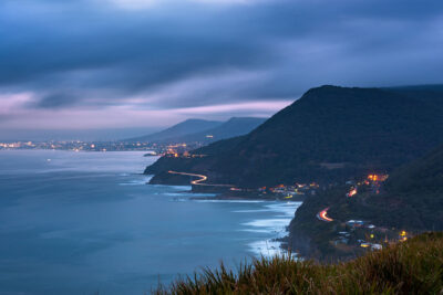 Twilight descends on a coastal road at Stanwell Tops Lookout in the captivating coastal photo Passing Time.
