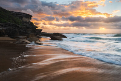 Natural patterns etched in the sand at Tamarama Beach, embodying the essence of sophisticated beach wall art.