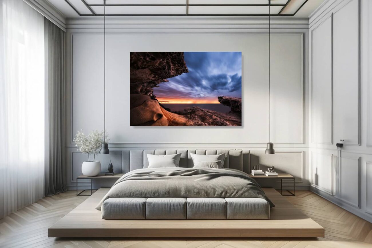 In the bedroom, canvas art depicts the rock formation at Tamarama Beach as it frames the twilight sky, creating a mesmerizing transition from day to night. This piece brings a sense of tranquility and wonder, ideal for fostering a peaceful and reflective bedroom environment.