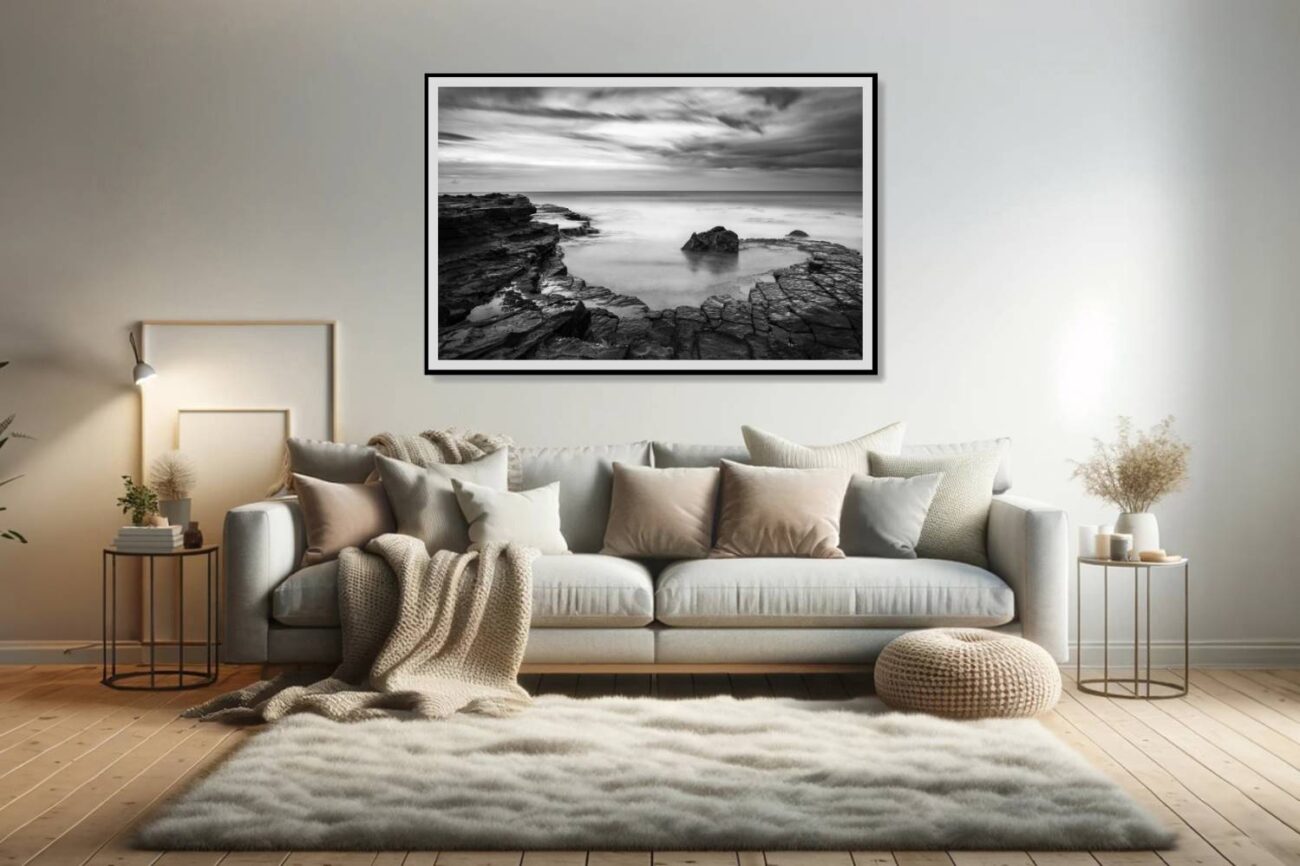 Living room art: Monochrome art of Garie Beach, featuring spiraling zen-like patterns of rocks and waves, showcased in a tranquil black and white photo for the living room.