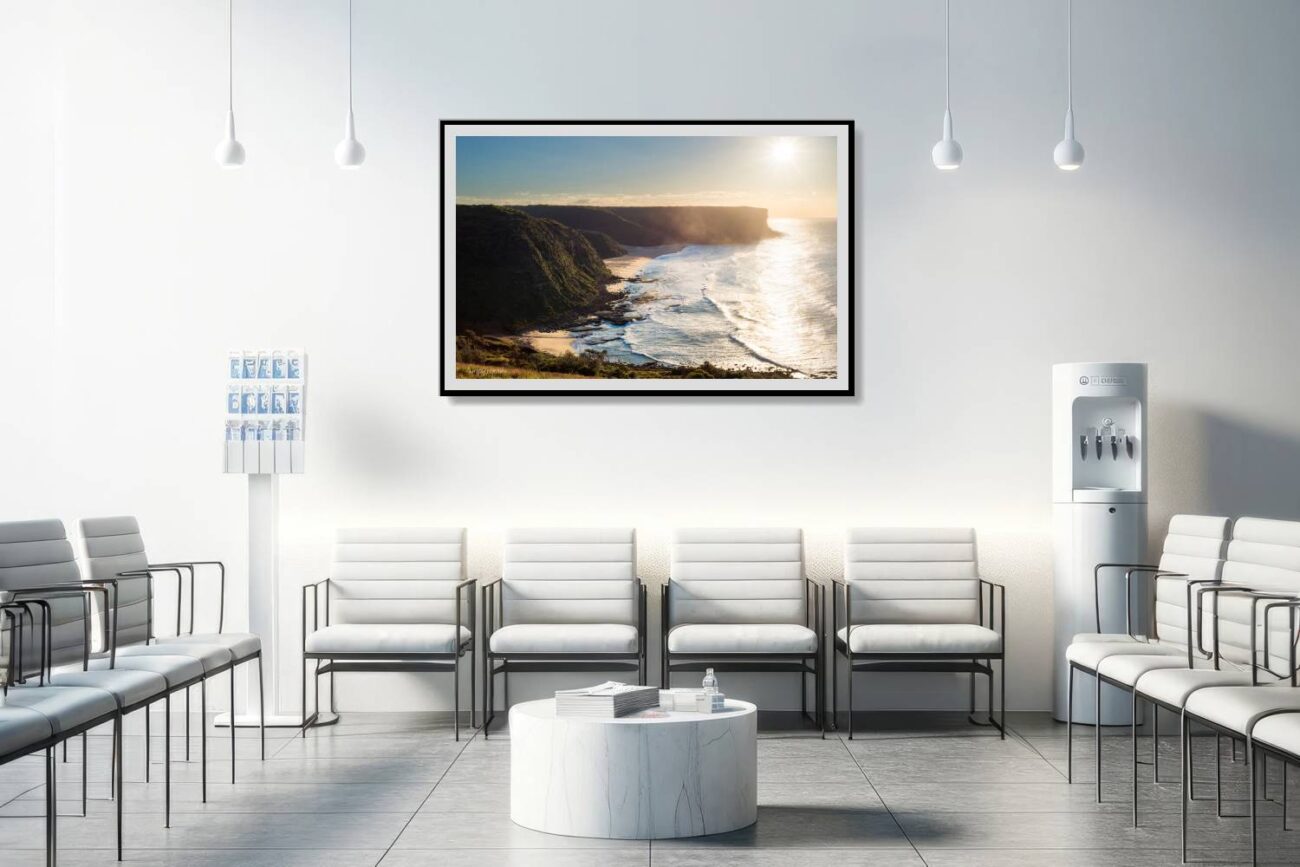Medical office art: Tranquil morning scene at Little Garie Beach with sunrise casting golden glow, soothing photo for medical environments.