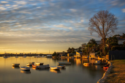 Dreamlike sunset at Taren Point, nature wall art with boats under a purple and gold sky.