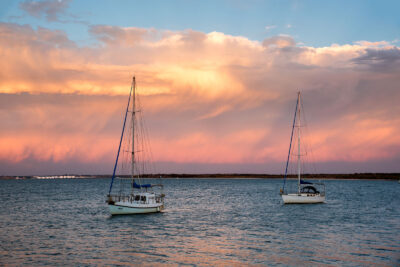 Sailboats at Taren Point enjoying the tranquil peach and mauve sunset, a serene nature wall art scene.